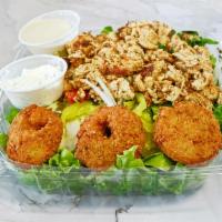 Chicken and falafel salad · Falafel, lettuce, tomato, cucumbers, onions, green peppers, and pickles with your choice of ...