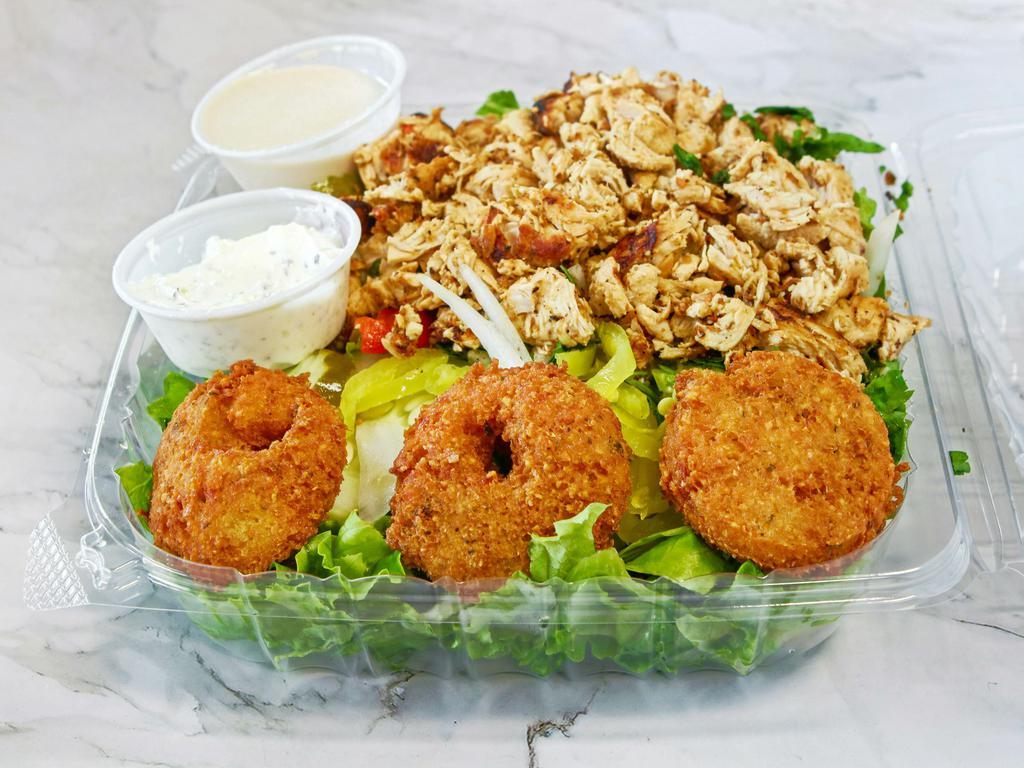 Chicken and falafel salad · Falafel, lettuce, tomato, cucumbers, onions, green peppers, and pickles with your choice of dressing.