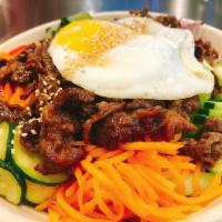 Beef Bulgogi Bibimbap · Korean bulgogi sauce marinated rib eye beef with steamed rice and all kinds of veggies with ...