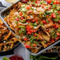 Nachos · Tortilla chips, black beans, tomatoes, 3 cheese blend, house-pickled jalapenos, scallions, s...