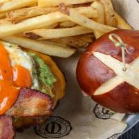 Chicago Fire Burger · Favorite. Bacon, fried egg, avocado, cheddar, Irish ghost wing sauce, pretzel bun. Consuming...