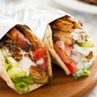 Shish Kebab Sandwich · Filet minion, lettuce, tomatoes, onions, pickles and tahini sauce.