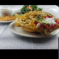 Fajita Salad · Flour tortilla shell with beans and grilled chicken or beef fajita. Served with lettuce, tom...