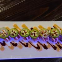 Caliente Roll · Salmon, yellow tail, avocado, cucumber with spicy tuna on top spicy mayo, unagi sauce and ja...