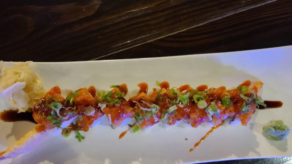 Northwest Roll · Shrimp tempura, avocado and spicy salmon on top, unagi sauce, spicy apple sauce with ikura, scallion.