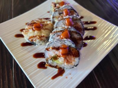 Firefighter Roll · Deep fried roll with spicy tuna, crab, avocado, cream cheese with spicy mayo, unagi sauce.No