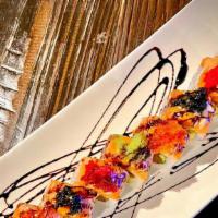 Ocean Roll · Spicy tuna roll with spicy yellow tail on top mango sauce, scallion, roasted garlic, balsami...