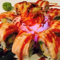 17. Volcano Roll · 8 pieces. Kani cucumber avocado topped with seared salmon and baked spicy kani, crunch on to...