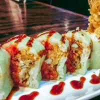 25. Spider Man Roll · 10 pieces. Soft fried tempura soft shell crab, spicy tuna, wrapped in green soy paper, eel s...