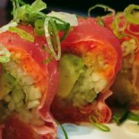26. Rice Less Roll · 10 pieces. No rice. Spicy tuna, avocado, cucumber, soy paper topped with fresh tuna, scallio...