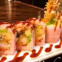 28. Pink Lady Roll · 10 pieces. Shrimp tempura, spicy tuna, avocado, eel with pink soy paper, eel sauce (soy pape...