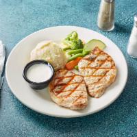 Twin Pork Chops · Two char- grilled center cut 8oz Pork Chops, served with mashed potatoes and mixed vegetables.