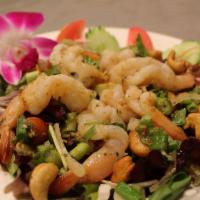 Pla Koong · Grilled shrimp with Manaao spicy lime dressing, cashew nut and mixed with greens & onions.