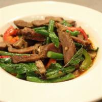 Kaprow Moo Yang · Stir-fried grilled pork, bell pepper, chili, onion, mushroom, string beans, Thai basil.