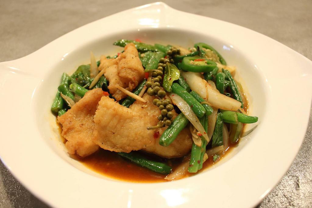 Pla Pad Cha · Deep-fried white fish filled, stir-fried with garlic, kaffir lime leaves, young green pepper, onion, bell pepper, jalapeno and basil leaves.