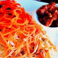 Qaubili Palau · Seasoned rice topped with fried sweet carrot strips and raisins, served with meat stew (qurm...