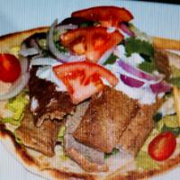 Gyro Sandwich · Combination beef and lamb delicately spiced, served with lettuce, onions, tomatoes and sauce...