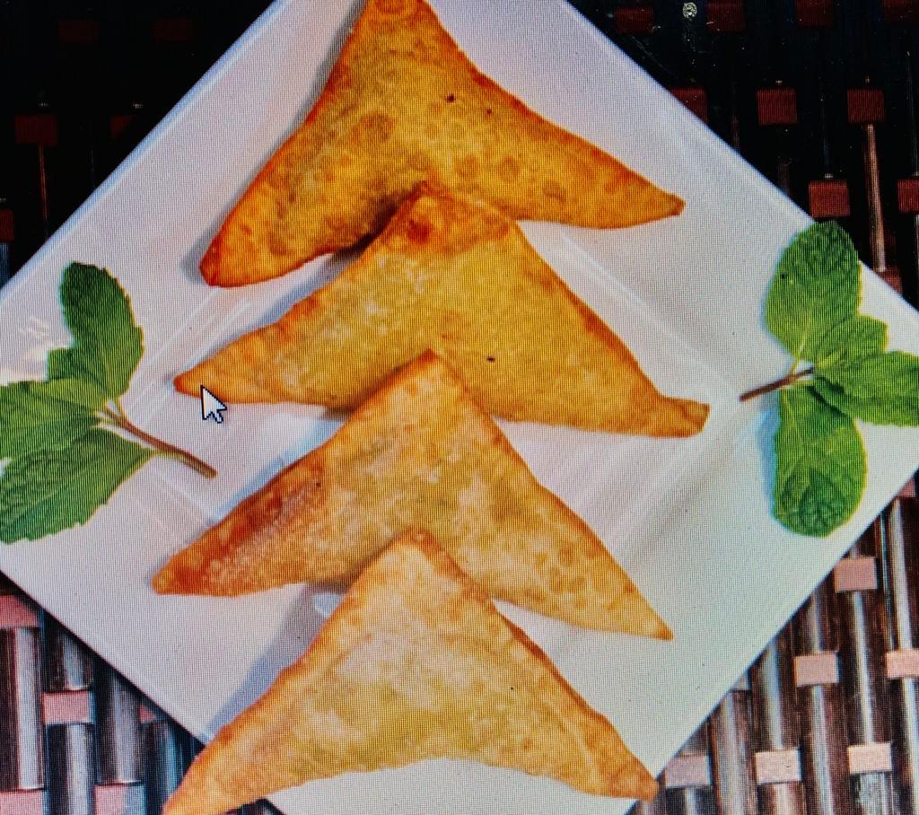  Sambosa · Fried pastry stuffed with chick peas and herbs.