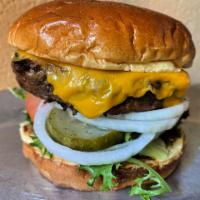 Emerald Burger · with all the trimmings (lettuce, tomato, onions, house made pickles + onion jam
