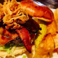 Hickory Burger · Thick-cut bacon, smoked brisket, crispy onion straws, cheddar cheese, Guinness BBQ sauce + t...