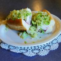 Sacks Improv Sandwich · Turkey breast, herb stuffing, cranberry sauce, shredded lettuce, and mayonnaise, on an 8-inc...