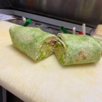 Evergreen Buritto · Scrambled eggs, turkey, spinach, bell pepper, onions and melted provolone cheese wrapped in ...