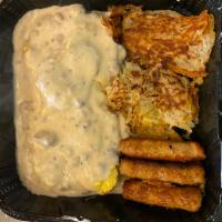 Hillsbery Scramble · 2 big hot delish biscuits topped with scrambled eggs smothered in Tempe’s best sausage gravy...