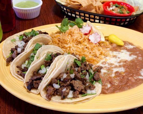 4 Mini Taco Lunch Special · Four mini tacos topped with onions, cilantro, and house green salsa and served with rice and beans. Choice of meat.