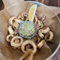 Fried Calamari · Crispy tender calamari flash fried & tossed in special house blend spices & Served with Crea...