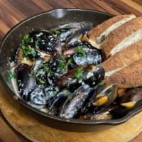 Drunken Mussels · Fresh mussels steamed in creamy broth of olive oil, white wine, garlic & ginger. served with...