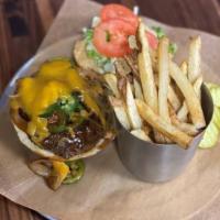 Cowboy Burger · 8 oz. burger topped with BBQ, cheddar, sauteed onions and jalapenos.
