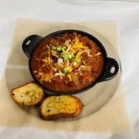 1/2 Size Chili · Our famous beef chili topped with cheddar jack cheese, sour cream & Green onions