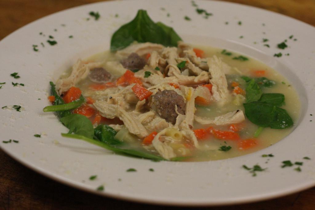 Wedding Soup · Classic style Italian chicken soup with fresh spinach, mini meatballs and pasta.