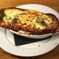 Eggplant Parmesan · Old world recipe of non breaded sliced eggplant layered with marinara and mozzarella cheese,...