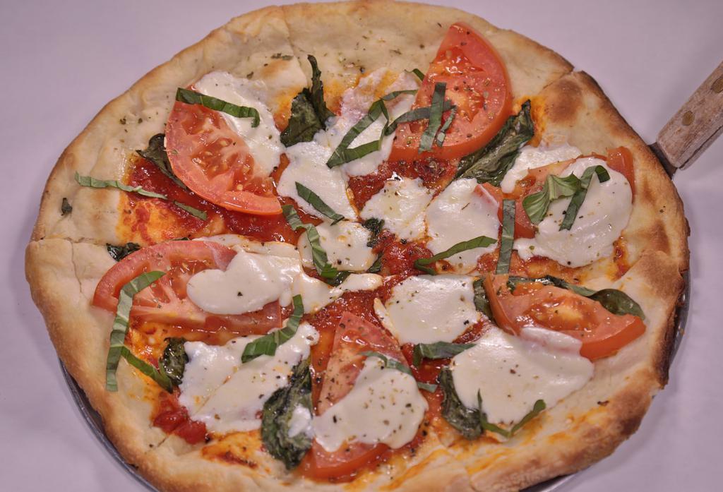 Margherita Pizza · Marinara, fresh basil and mozzarella di latte.