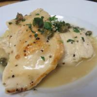 Chicken Picatta · Tender boneless chicken breast with capers sauteed in a lemon white wine butter sauce served...