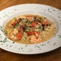 Shrimp Scampi · Pan seared jumbo prawns served with a white wine butter sauce over angel hair pasta.