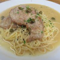 Veal Piccata · Pan seared veal scaloppini and capers, sauteed in a lemony white wine butter sauce served ov...