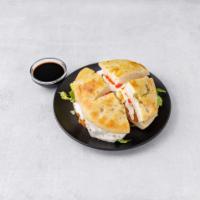 Chicken Focaccia-FM-RP · Chicken, Fresh mozzarella, roasted red peppers and romaine lettuce. Served with balsamic and...