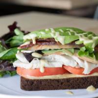 Paleo Turkey Club · Roast turkey, bacon, greens, tomato, avocado, mayo and maple mustard vinaigrette served open...