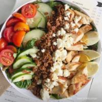 The Naughty Cobb Salad · Chicken, egg, bacon, feta, tomato, cucumber and maple bacon granola with your choice of dres...