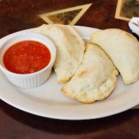 Mini Calzones · 3 mini calzones stuffed with spinach, ricotta, and mozzarella cheeses. Served with marinara ...