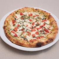 3 Cheese Pizza · Pesto Sauce, parmesan, mozzarella and fontina cheeses with fresh tomatoes and basil.