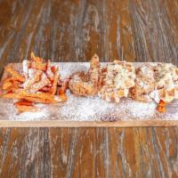 Chicken & Waffles · 2 Belgian waffles topped with a fried chicken breast, maple bacon butter and powdered sugar ...