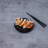  Gyoza · Pan-fried pork or vegetable dumplings (6pcs) with gyoza sauce 