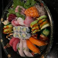 Sushi Sashimi for 2 · Assorted raw fish by chef's choice, 1 California roll and 1 dragon roll.