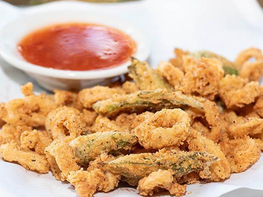 Flash Fried Calamari · Thinly sliced wild calamari and okra halves, hand-battered and flash-fried. Served with choice of our homemade marinara or sweet Thai chili sauce.