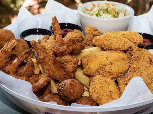 Fry Me to the Moon · A fishermen’s feast! Five large fried shrimp, full serving of our southern fried catfish, three fried oysters, and three Bombs. (Contains Pork)