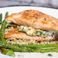 Crab & Artichoke Stuffed Salmon · Grilled Atlantic salmon filled with our homemade stuffing of crab, artichoke hearts, fresh s...