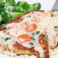 Herb Crusted Chicken · Herb parmesan crusted chicken, topped with lemon butter sauce, tomatoes, fresh spinach, and ...